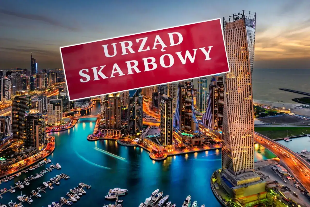 Widok na Dubaj nocą z tablicą